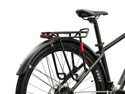 A close-up of the rear section of a KROSS Hexagon X200 EQ mountainbike, showcasing the sturdy rack and tire.